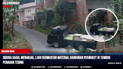 Diduga Gagal Menanjak, L300 Bermuatan Material Bangunan Nyangkut di Tembok Penahan Tebing